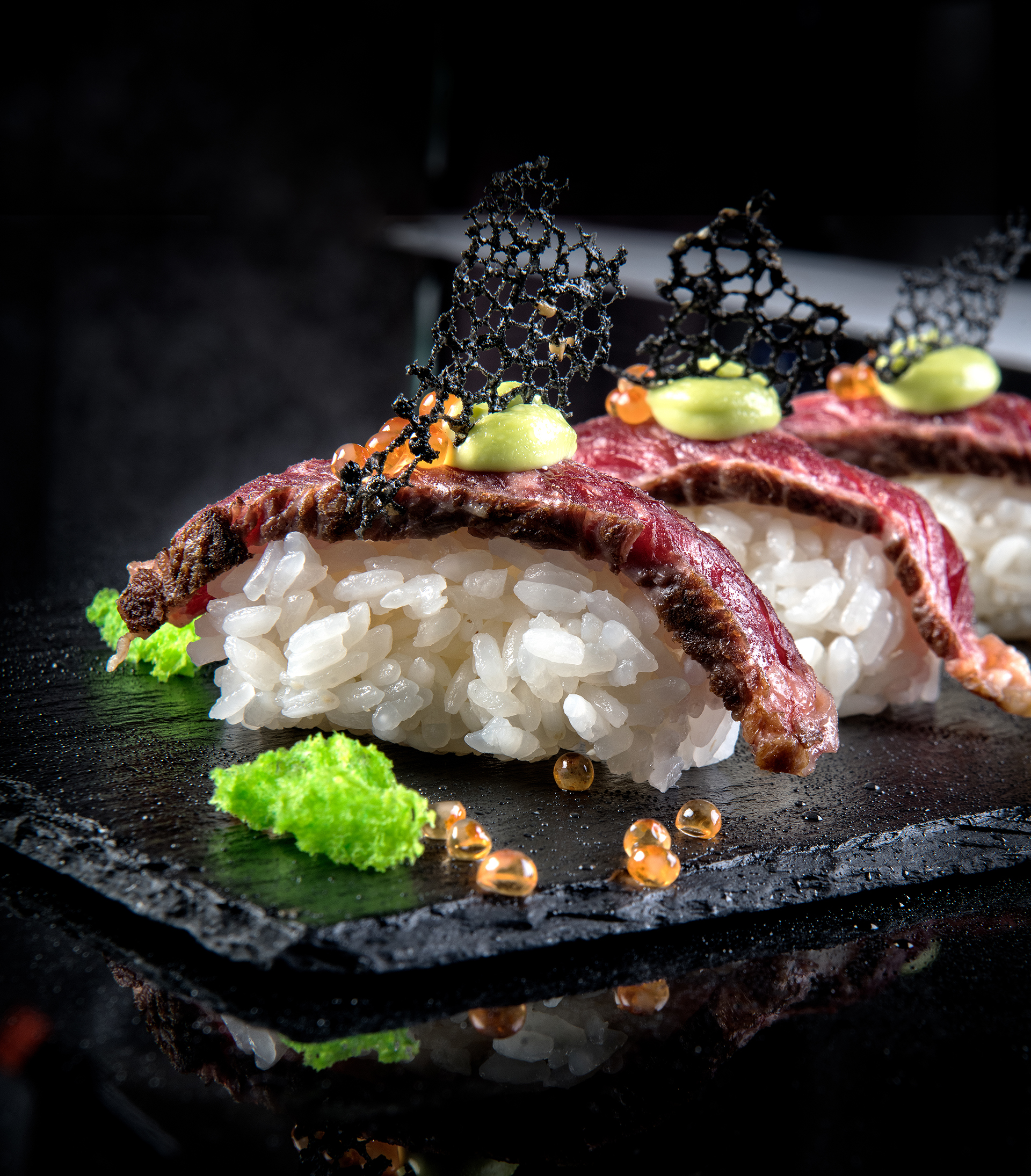 Delectable sirloin steak strips on rice in restaurant